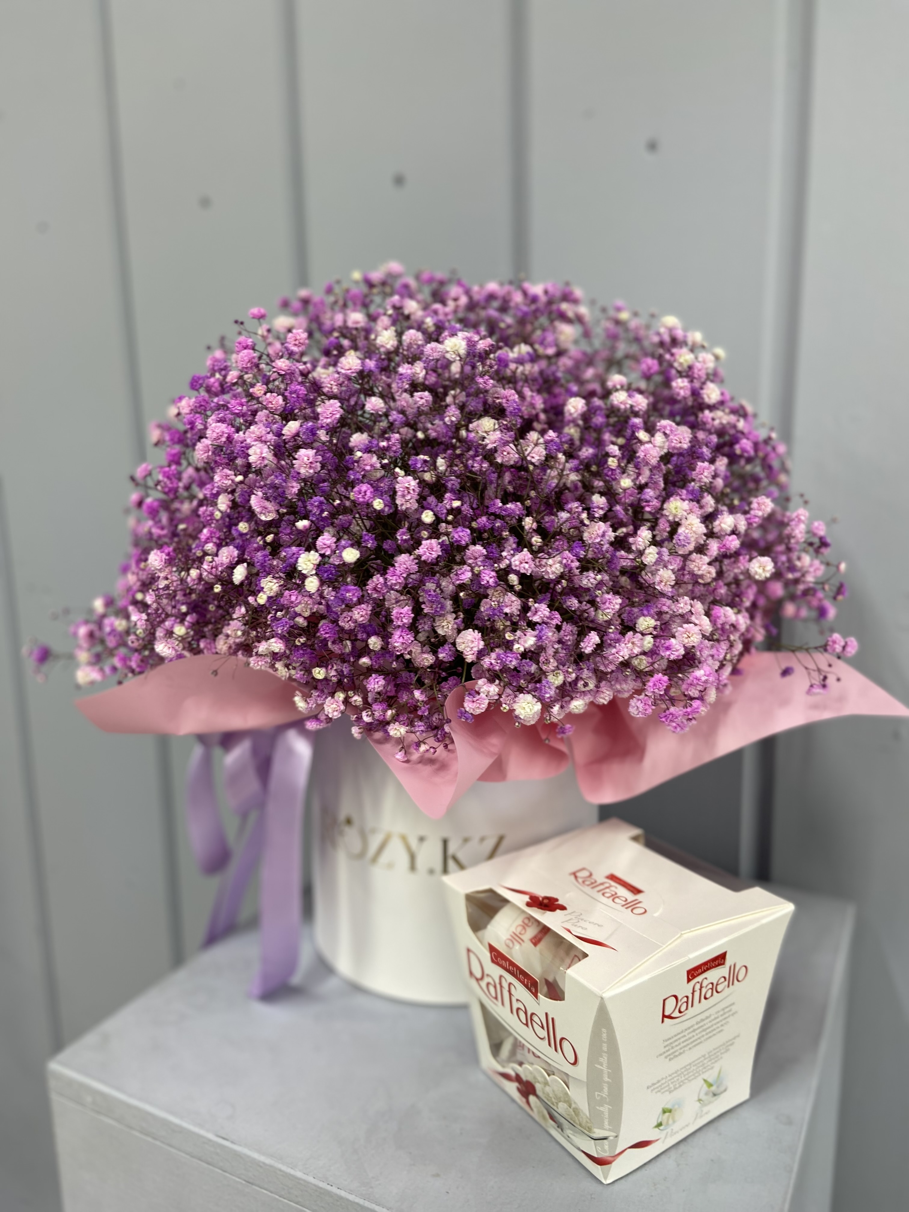 Bouquet of Box size M made of pink gypsophila and Raffaello flowers delivered to Astana