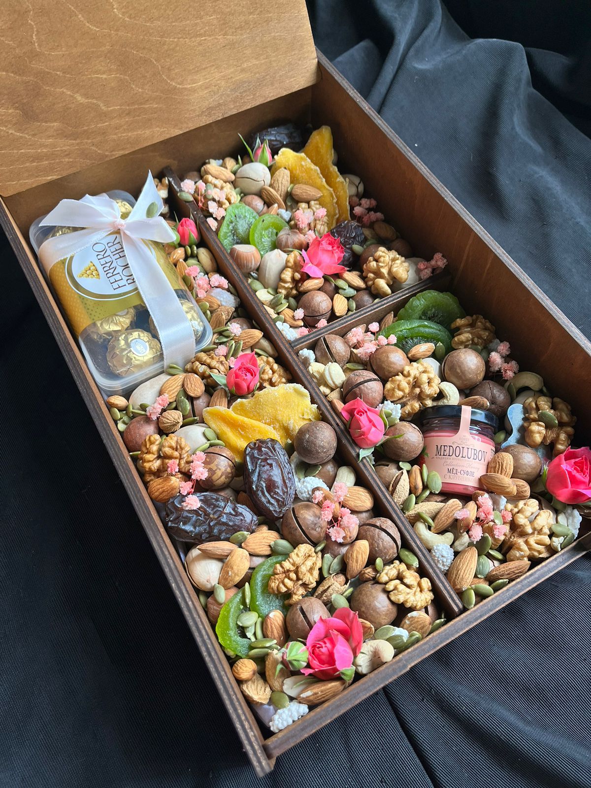 Bouquet of box with nuts, dried fruits and chocolate flowers delivered to Astana