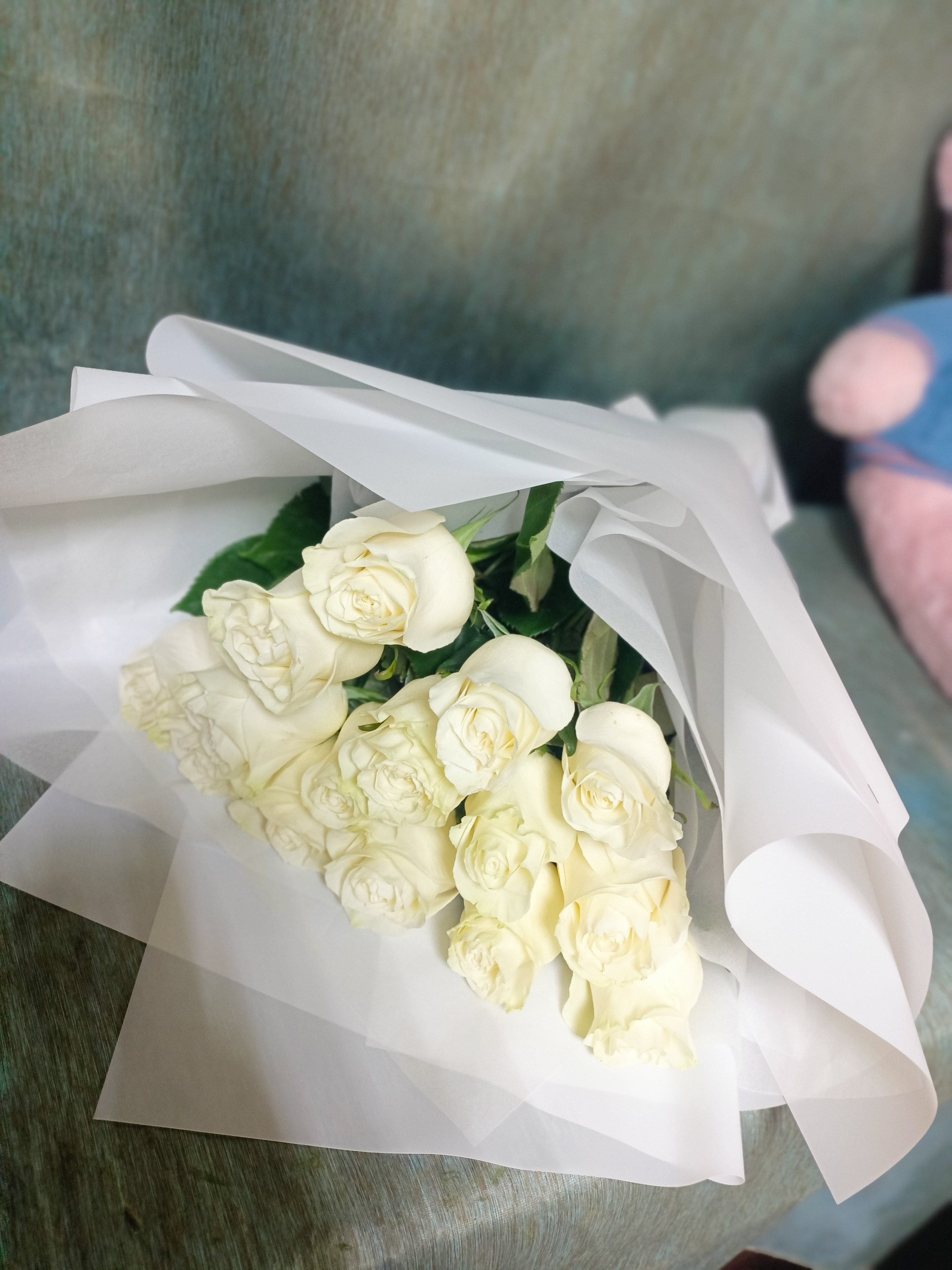Bouquet of 15 delicate white roses of premium mondial variety flowers delivered to Kostanay.