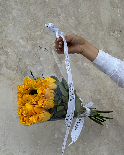 Bouquet of 15 yellow roses in a transparent bag flowers delivered to Astana