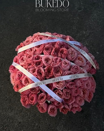 Peony roses in a basket with delivery to Shymkent