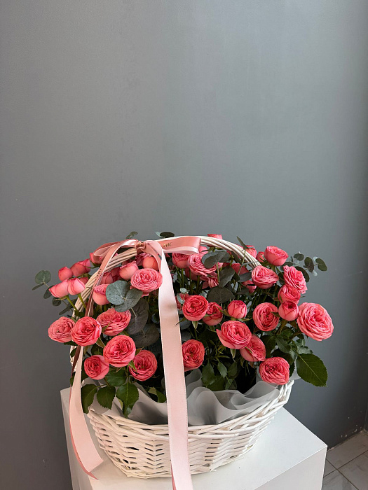 A composition of bush roses in a basket
