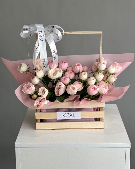 Wooden basket of peony roses 