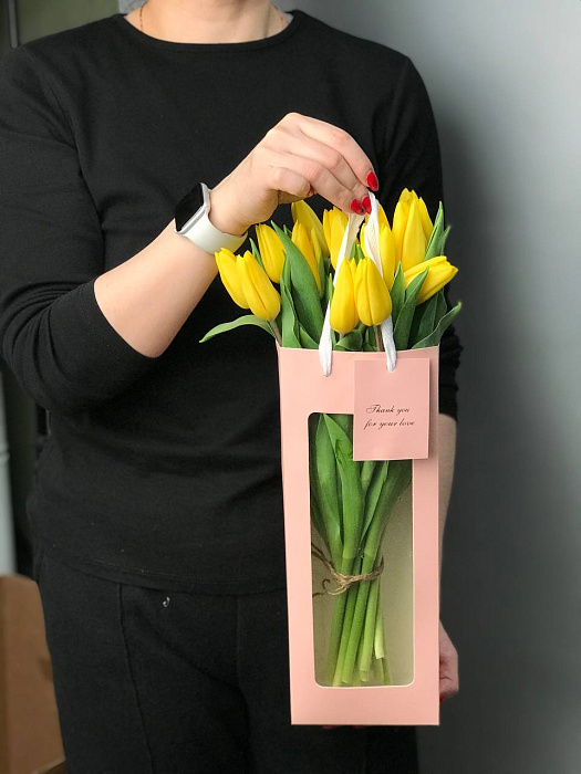 Yellow tulips in a gift box