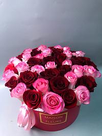 Bright roses in a refined box of a round form