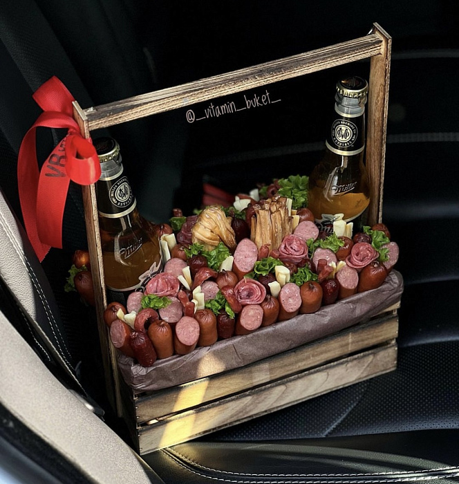 Box with sausages and beer