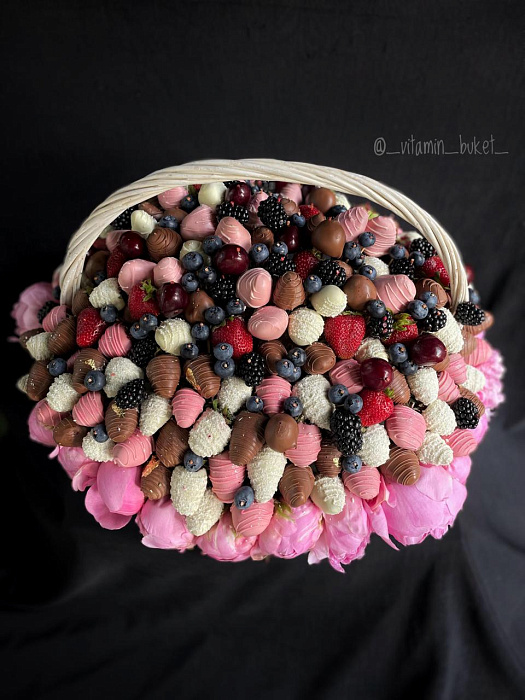 Basket of strawberries and cherries in chocolate