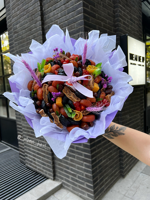 Dried fruit bouquet with a jar of honey.