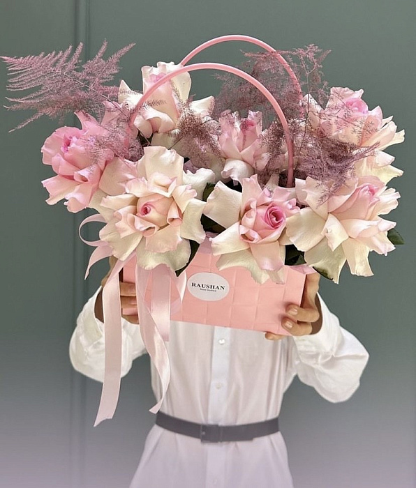 Arrangement of flowers in a handbag