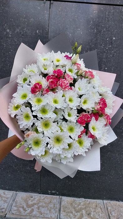 An armful of chrysanthemums with addition