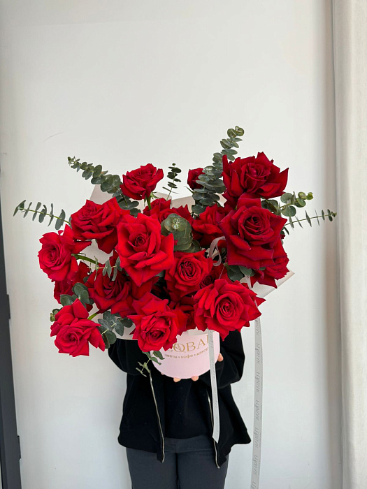 Open red roses in a box Open red roses in a box