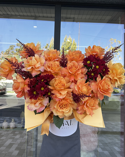 Bouquet of Bright composition in orange shades flowers delivered to Shymkent