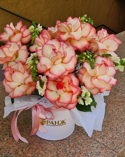 Bouquet of French roses in a hatbox flowers delivered to Almaty