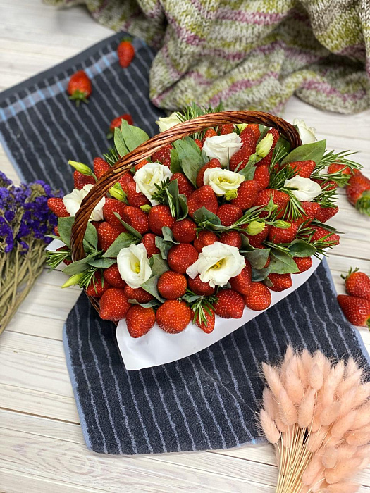 Strawberries in a basket with flowers
